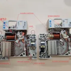 Wnętrze wyłącznika nadprądowego: widoczny magnez, cewka, mechanizm wyzwalacza zwarciowego i przeciążeniowego, komora gaszenia, styk stały i ruchomy.