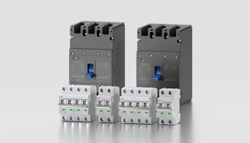 Dwa duże szare i cztery mniejsze białe wyłączniki elektryczne na jasnym tle.
